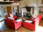 The living room with stone fireplace